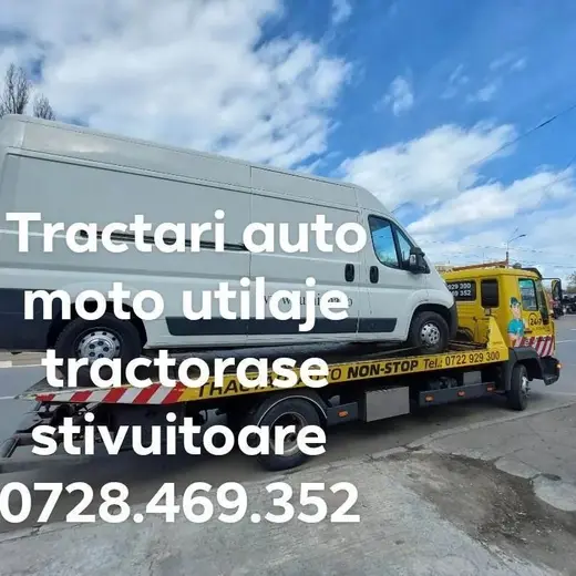 Duba albă de marfă încărcată pe platforma hidraulică a mașinii de tractare